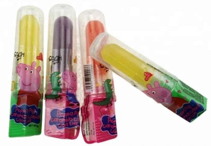 Φωτεινό να λάμψει φως επάνω στη γεύση φρούτων μορφής Lollipop καραμελών για τα παιδιά